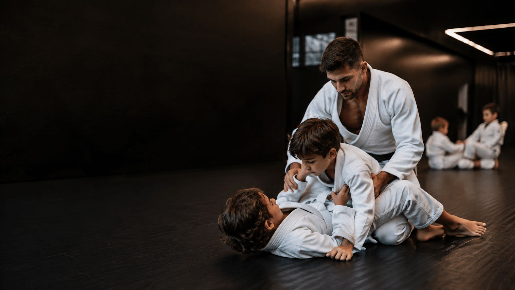 Kids Brazilian Jiu-Jitsu positional training with a coach at Chess Club Martial Arts